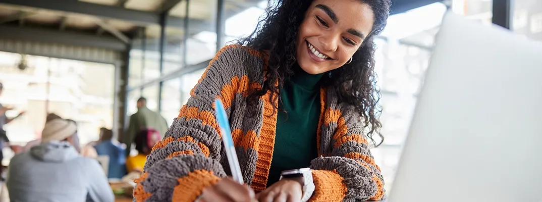 A woman writing on a paper