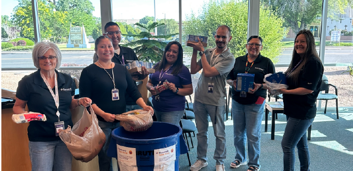 Sunward employees handling food donations.