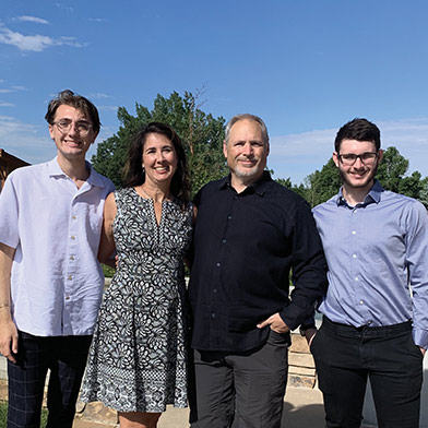 Photo of CEO Steph Sherrodd with her husband and two sons.