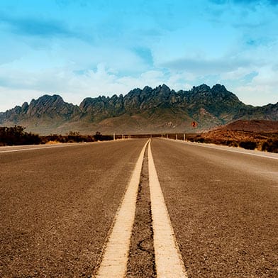 Photo of highway and Organ Mountains near Las Cruces, New Mexico