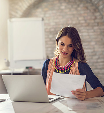 Young woman looking at paperwork