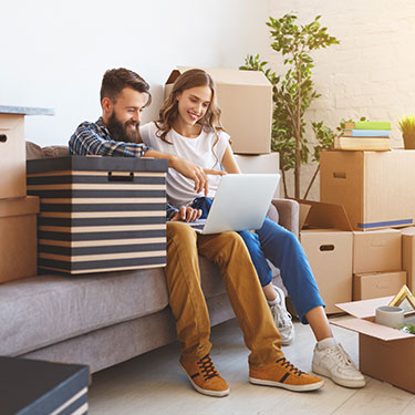 Man and woman looking at laptop