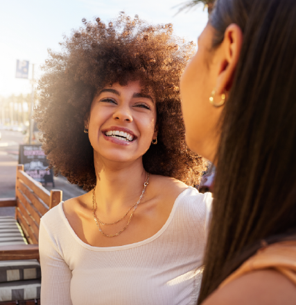 A smiling woman shopping online
