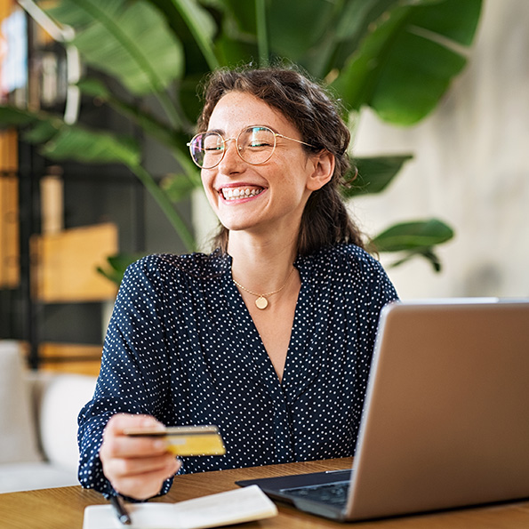 A smiling woman shopping online