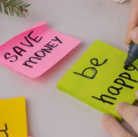 Post-its read Save money and be happy